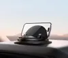A car phone mount with a phone attached, placed on a car dashboard. Náhled obrázku produktu