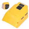 A close-up view of a yellow battery charger adapter with USB ports and buttons. Náhled obrázku produktu