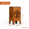 A rusty metal fire pit with a tree of life design, showing dimensions. Produktbild-Vorschau