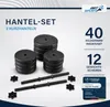 A set of dumbbells and weight plates are displayed on a white and light gray background. Produktbild-Vorschau