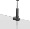 A close-up shot of a black tablet holder clamped to a clear surface. Náhľad obrázku produktu