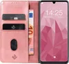 A pink flip cover phone case with card slots and a banknote, next to a smartphone displaying the time and date. Produktbild-Vorschau
