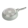 The underside of a frying pan is shown against a white background. Náhľad obrázku produktu