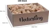 A cardboard box filled with wood wool fire starters, with dimensions and quantity indicated. Produktbild-Vorschau