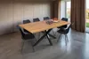 A dining table with chairs in a modern dining room. Produktbild-Vorschau