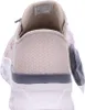 The back view of a beige sneaker with a white sole. Anteprima dell’immagine prodotto