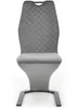 A gray dining chair with a quilted backrest and a sleek, modern base, photographed from the front on a white background. Produktbild-Vorschau