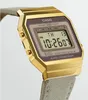 A close-up, angled shot of a gold-colored digital watch with a fabric strap. Voir les images du produit