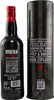 A bottle of Smokehead Sherry Cask Blast Scotch Whisky next to its cylindrical packaging. Produktbild-Vorschau