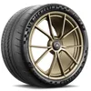 A close-up studio shot of a Michelin tire mounted on a gold rim. Podgląd zdjęcia produktu