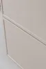 A close-up view of a beige cabinet with a horizontal groove. Produktbild-Vorschau