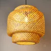 A close-up shot of a hanging lamp made of woven bamboo. Anteprima dell’immagine prodotto