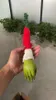 A hand holding a Grinch-themed Christmas ornament. Produktbild-Vorschau
