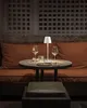 A table setting in a dimly lit restaurant or bar. Produktbild-Vorschau