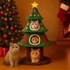 A festive Christmas scene with cats interacting with a Christmas tree-shaped cat tree near a fireplace. Anteprima dell’immagine prodotto