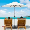 Two people relaxing on lounge chairs on a beach under a white umbrella. Produktbild-Vorschau