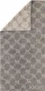 A folded towel with a geometric pattern. Produktbild-Vorschau