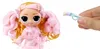 A doll and a small accessory held by a hand against a white background. Voir les images du produit