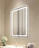 A bathroom vanity with a sink, faucet, and a lit mirror. Anteprima dell’immagine prodotto