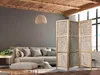 A living room scene with a sofa, ottoman, and a room divider. Náhled obrázku produktu