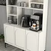 A white cabinet with three arched doors, a black air fryer, and a black coffee machine with a latte in a glass. Produktbild-Vorschau