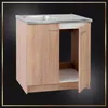 A kitchen cabinet with a sink and an open door. Voir les images du produit