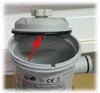 A close-up view of a gray plastic filter housing with a black rubber O-ring seal, highlighted by a red arrow. Produktbild-Vorschau