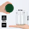 A hand holds a green lid over a glass jar, with dimensions and weight information displayed. Podgląd zdjęcia produktu