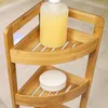 A close-up view of a bamboo corner shelf with two items on it. Podgląd zdjęcia produktu