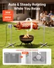 A rotisserie grill with a whole roasted pig cooking over a fire, with people dining in the background. Voir les images du produit