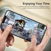 Hands holding a smartphone displaying a video game. Produktbild-Vorschau