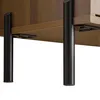 A close-up view of the bottom section of a TV stand, showing its wooden texture and black metal legs. Anteprima dell’immagine prodotto