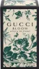 The image shows the front of a Gucci Bloom Acqua di Fiori perfume box, featuring floral illustrations and brand text. Produktbild-Vorschau