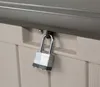 A close-up shot of a padlock securing a tan plastic storage box. Podgląd zdjęcia produktu