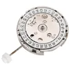 A close-up view of a watch movement with a date complication, set against a white background. Náhled obrázku produktu