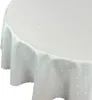 A close-up, angled view of a white, round tablecloth with a subtle white polka dot pattern. Náhľad obrázku produktu