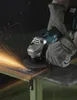 A person is using an angle grinder to cut metal, creating sparks. Produktbild-Vorschau