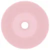 A top-down view of a pink ceramic sink with a central drain hole. Náhled obrázku produktu