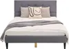 A bed with pillows and a blanket on a white background. Voir les images du produit