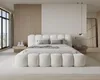 A modern bedroom with a large bed. Voir les images du produit
