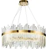 A circular chandelier with many clear crystal-like rods hanging from a gold ring, suspended by thin wires from a gold ceiling mount. Produktbild-Vorschau