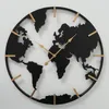 A world map clock on a white wall. Anteprima dell’immagine prodotto