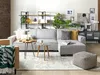 A modern living room with a sectional sofa, coffee tables, shelves, and plants. Náhled obrázku produktu