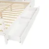 A close-up view of the white wooden drawers of a bed frame. Produktbild-Vorschau