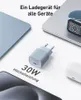 A charger and various electronic devices are displayed on a white background. Anteprima dell’immagine prodotto