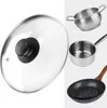 A collage of kitchenware, including a glass pot lid, a small saucepan, a larger pot, and a frying pan. Podgląd zdjęcia produktu