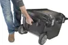 A person is pulling a black rolling toolbox. Anteprima dell’immagine prodotto