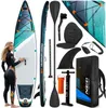 A woman in a wetsuit stands next to a paddleboard and its accessories, all arranged for a product display. Náhled obrázku produktu