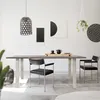 A modern dining room with a table and chairs, decorated with artwork and plants. Náhled obrázku produktu