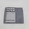 A close-up of a car cabin air filter with its packaging. Anteprima dell’immagine prodotto